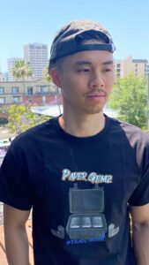 Man wearing a black Paper Gemz T-shirt